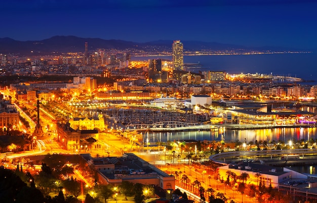 Free photo port vell and barcelona cityspace in night
